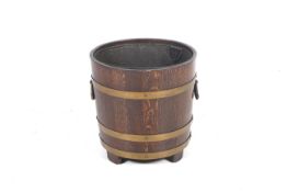 A Victorian oak coal bucket.