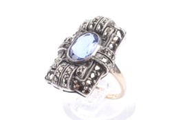 A vintage oval blue paste and marcasite rectangular cluster ring in Art Deco style.