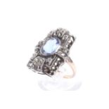 A vintage oval blue paste and marcasite rectangular cluster ring in Art Deco style.