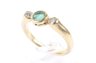 A vintage 18ct gold, emerald and diamond three stone ring,