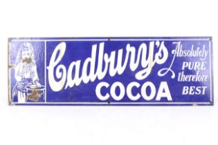 A vintage enamel advertising sign for 'Cadbury's Cocoa'.