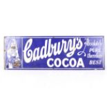 A vintage enamel advertising sign for 'Cadbury's Cocoa'.