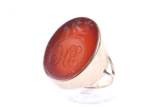 A vintage gold signet ring set with a Victorian oval carnelian intaglio. The carnelian approx, 24.