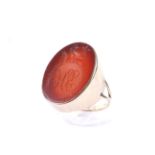 A vintage gold signet ring set with a Victorian oval carnelian intaglio. The carnelian approx, 24.