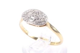 An early 20th century gold and diamond three stone oval ring, circa 1925.