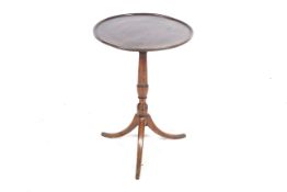 A 19th century mahogany tilt-top occasional table.