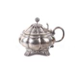 A George IV English provincial silver melon-fluted mustard pot.