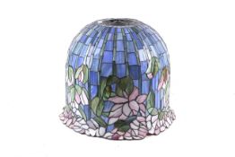 A large Tiffany style flowering lotus lampshade in blue and pink.