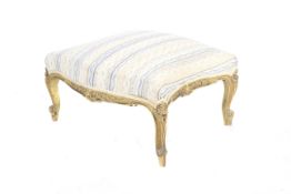 A Regency giltwood stool.