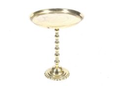A 20th century brass occasional table.