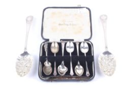 A pair of late Victorian silver feather-edge and cartouche handled 'berry' spoons and other spoons.