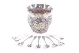 A late Victorian silver embossed sugar bowl and various German '800' standard rose spoons.
