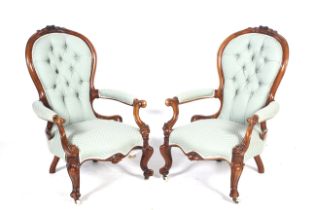 A pair of 19th century spoon-back open armchairs.