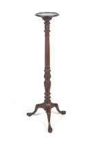 A 19th century mahogany plant stand or torchere.