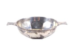 A silver quaich with two flat handles and a lobed bowl.