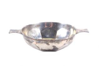 A silver quaich with two flat handles and a lobed bowl.