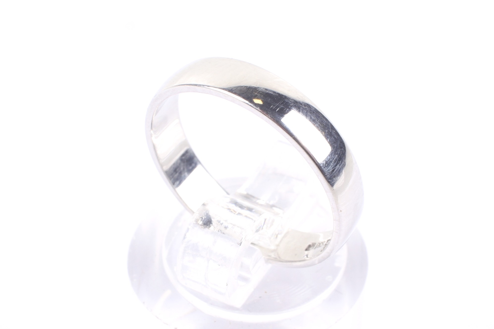 A modern platinum D-section wedding band. Hallmarks for London 2000 (Millenium mark), 3.