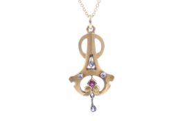 An early 20th century gold, rose diamond and synthetic ruby openwork pendant.