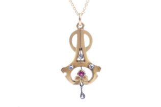 An early 20th century gold, rose diamond and synthetic ruby openwork pendant.