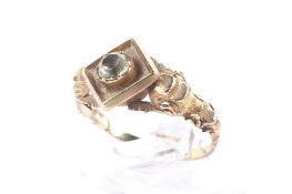 A late Victorian gold and chrysolite single stone locket-back ring.