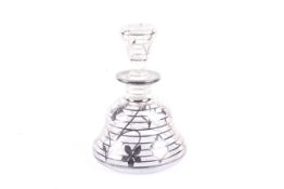 A Continental mounted clear glass bell shaped perfume bottle and stopper.