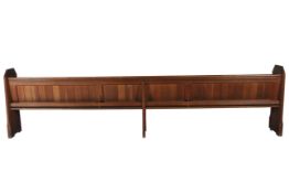 An early 20th century oak church pew.