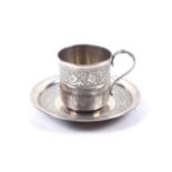 A French silver small cup and saucer.