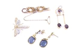 Four Edwardian and later gold and gem set jewels comprising;