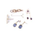 Four Edwardian and later gold and gem set jewels comprising;