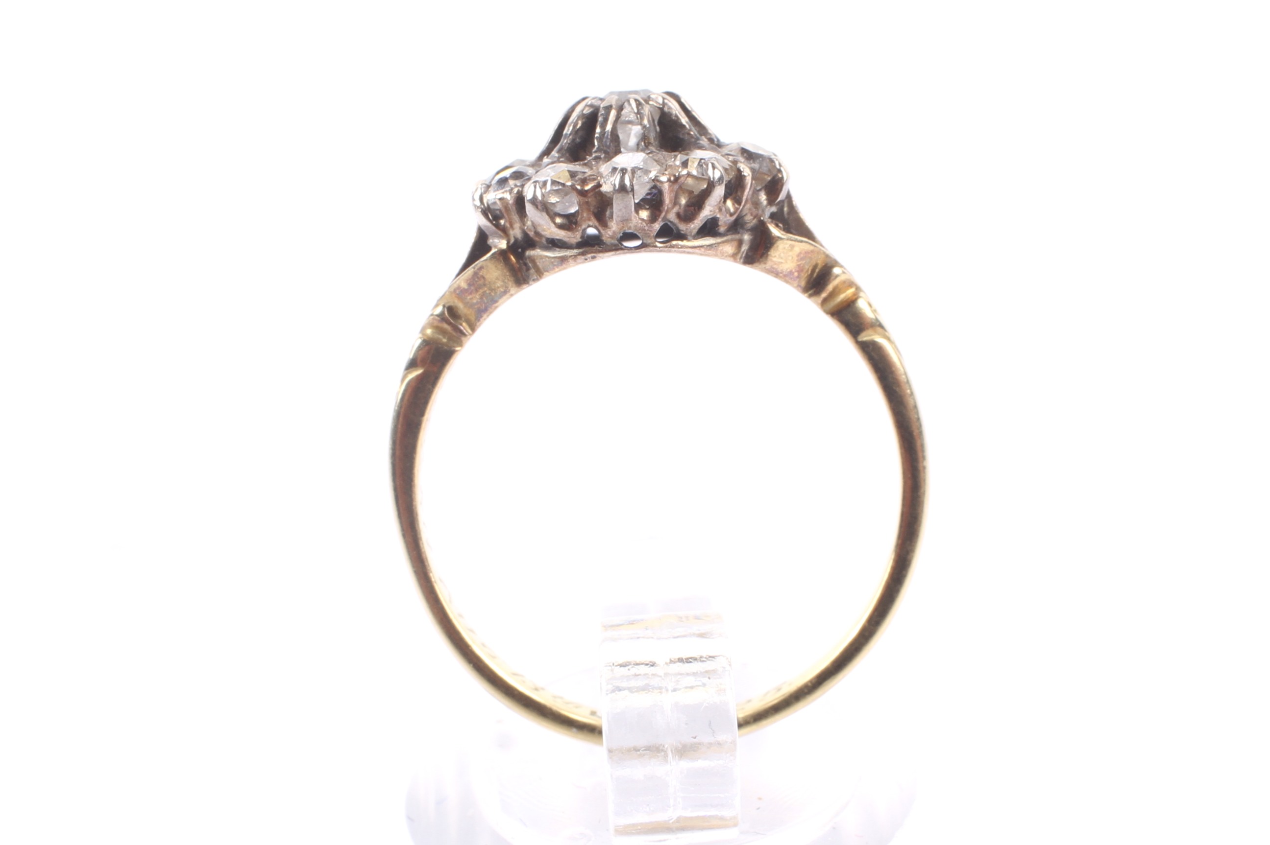 An early 20th century gold and diamond cluster ring. The 11 old-cut stones approx. 1. - Image 3 of 4