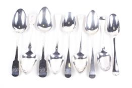 Nine various George II and later table spoons.