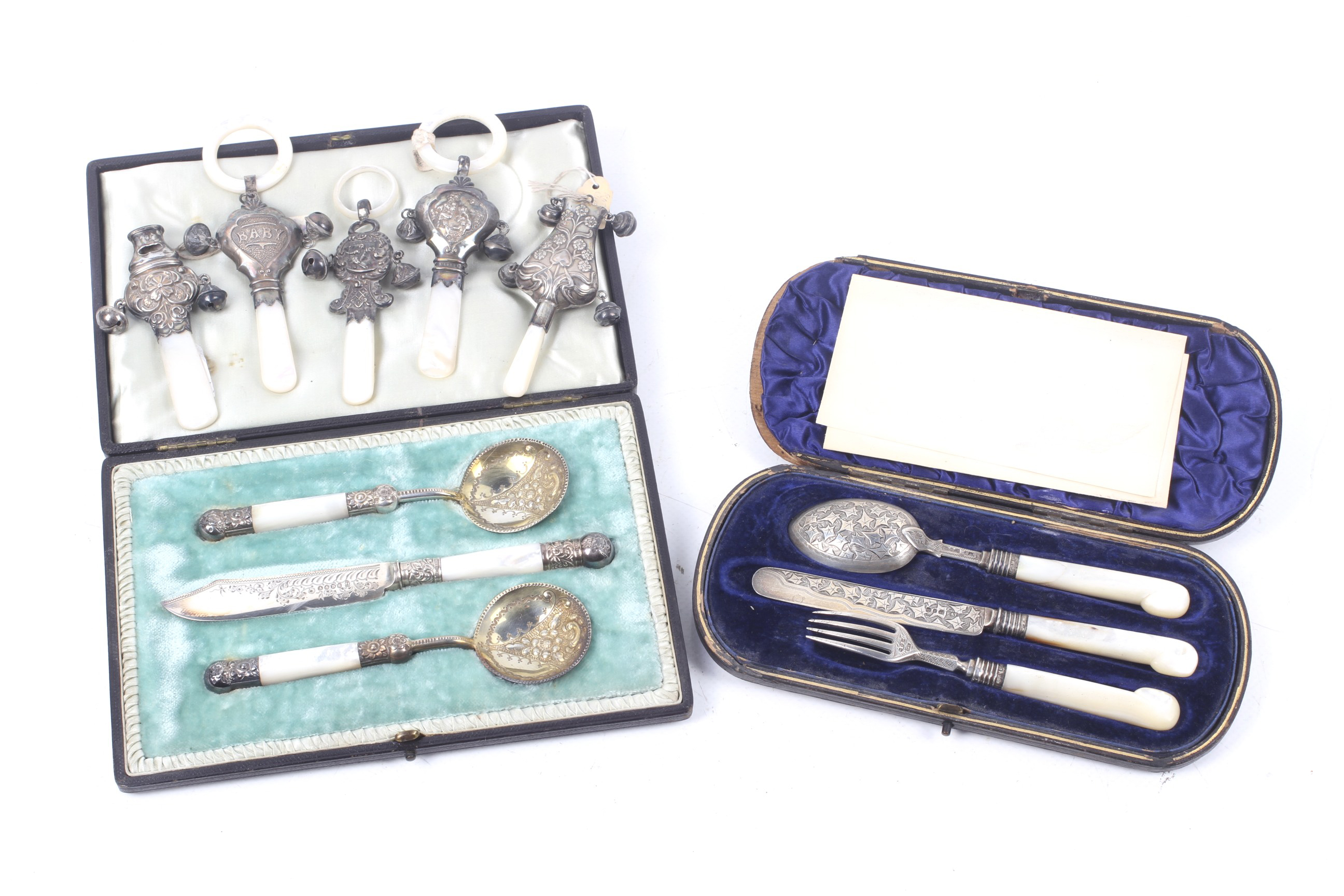 Five various early 20th century baby's silver and mother of pearl rattles/teethers and other items.