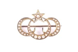 A late Victorian gold and half-pearl triple crescent and star brooch. Apparently unmarked, approx.