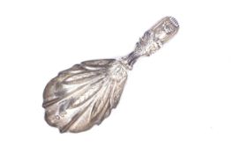 A George III silver fiddle, thread and shell pattern caddy spoon.