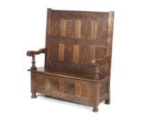 An early 18th century oak settle.
