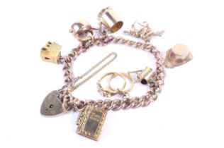 An early 20th century rose gold curb link 'charm' bracelet. Each link stamped '9 .