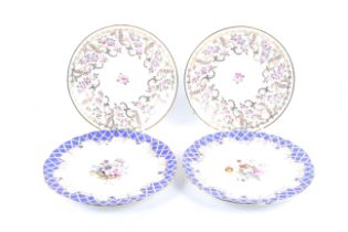 Two pairs of 19th century floral decorated plates.