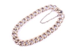 An early 20th century rose gold hollow curb link braclet.