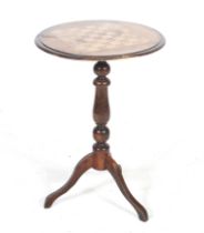 A satinwood inlaid chess top wine stand on a trip base. H69.5cm.