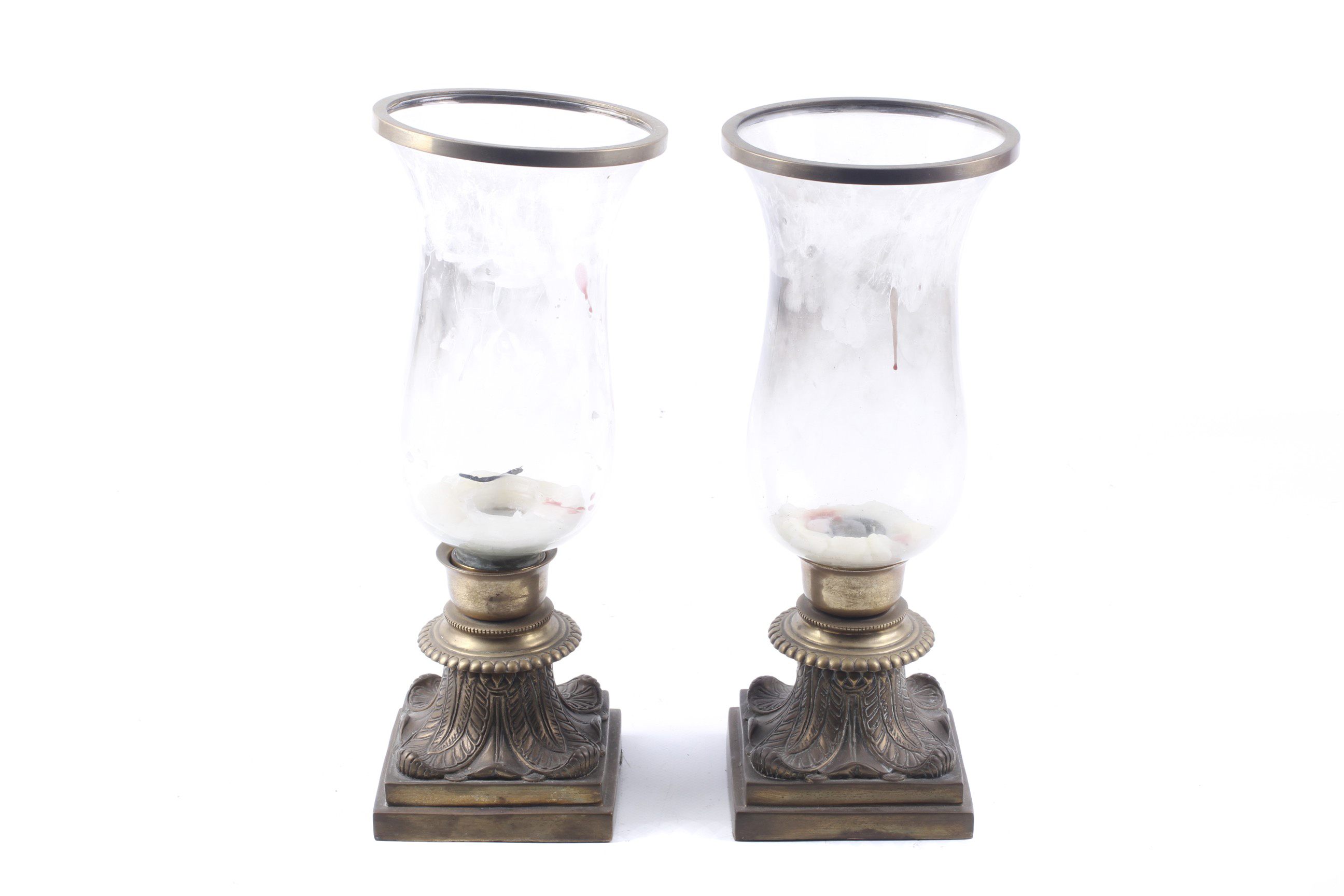 A pair of Victorian candle lamps. With glass shades, mounted on brass stepped square bases.