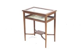 An Edwardian mahogany bijouterie table.