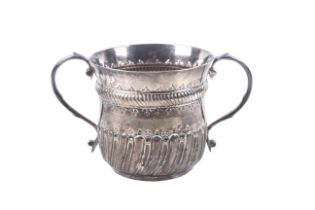 A Victorian Britannia standard silver two handled porringer in Queen Anne style.