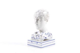 A small ceramic phenology head. 'By F. Bridger'.Porcelain with a glazed finish H14cm.