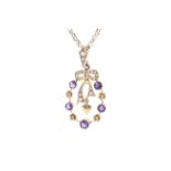 An Edwardian gold, amethyst and half-pearl open floret and ribbon-tied bow open pendant.