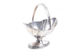A silver shaped-oval pedestal sugar bowl.