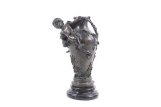 A patinated bronze vase on marble base.