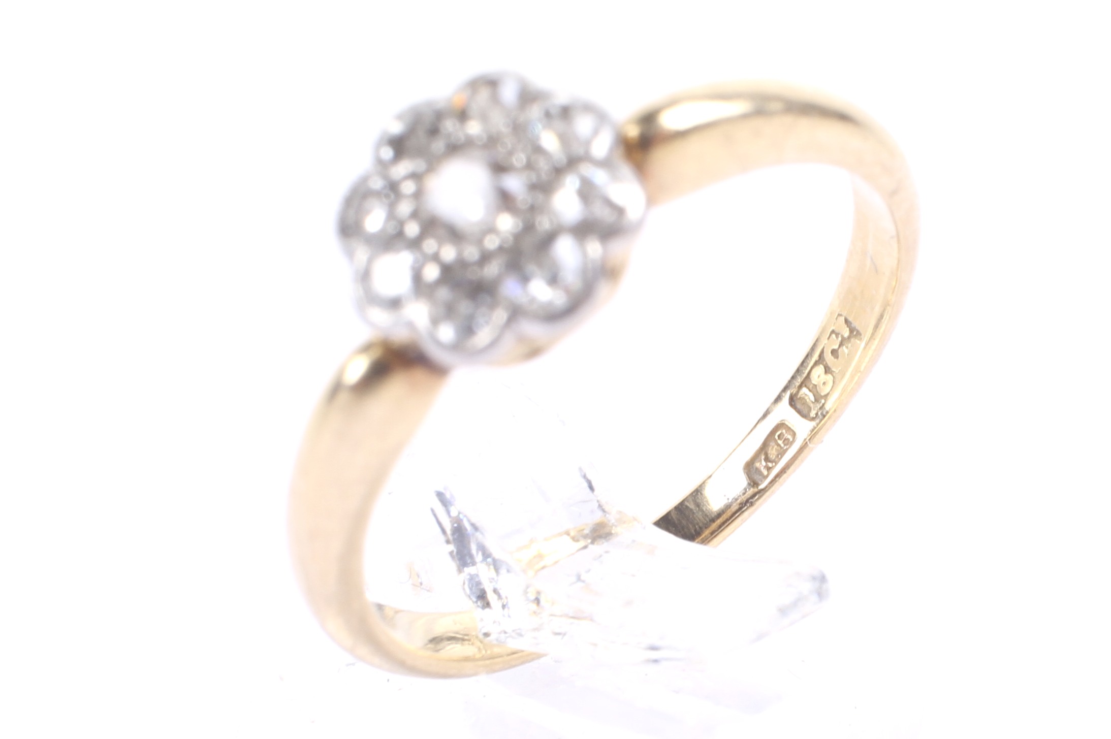 An early 20th century gold and diamond 'daisy' cluster ring, circa 1925. - Image 4 of 4