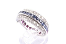 A mid 20th century platinum, ruby, sapphire and diamond 'Night and Day' hinged eternity ring.