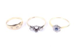 Three early 20th century gold and gem set rings.