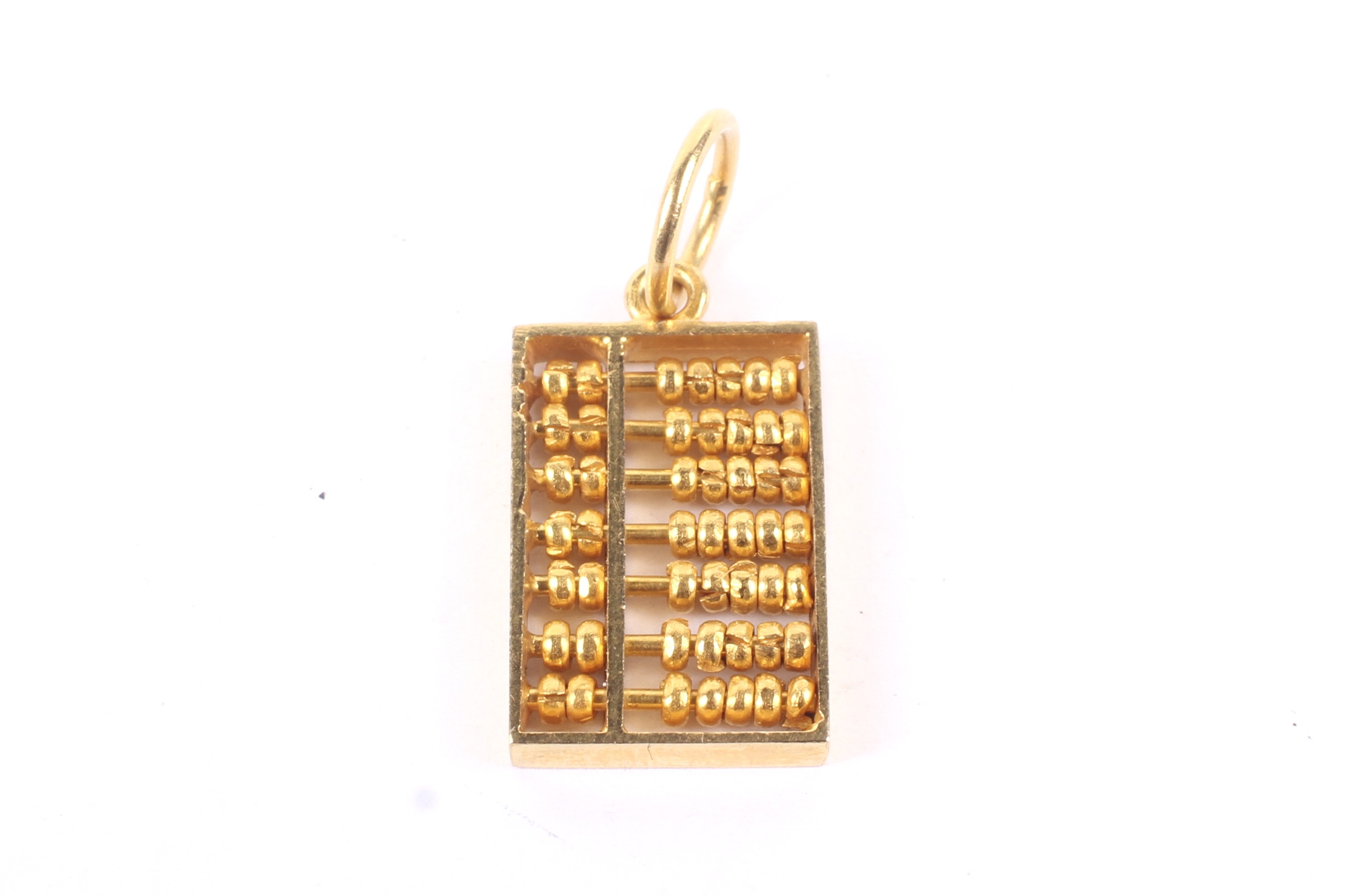 An Asian or middle-eastern high carat 'abacus' charm. Apparently unmarked, approx. 20.